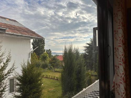 a view of a yard from a window of a house at Silver Woods- A Boutique Cottage in Srinagar