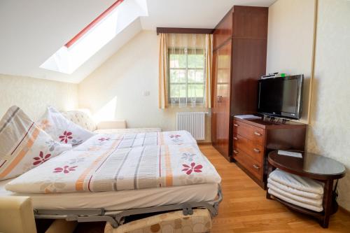 Ένα ή περισσότερα κρεβάτια σε δωμάτιο στο Vila Silva Marija Apartments