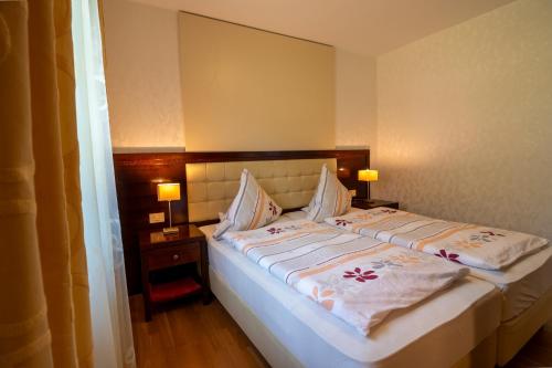 Ένα ή περισσότερα κρεβάτια σε δωμάτιο στο Vila Silva Marija Apartments