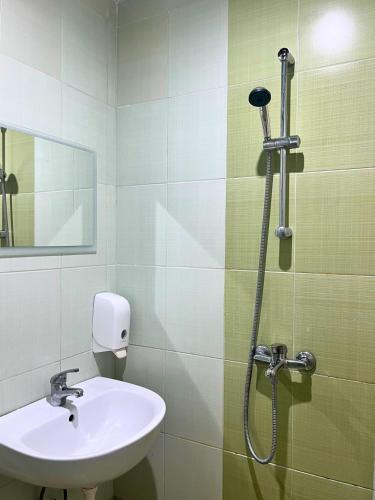 a bathroom with a sink and a shower at STELA in Nesebar