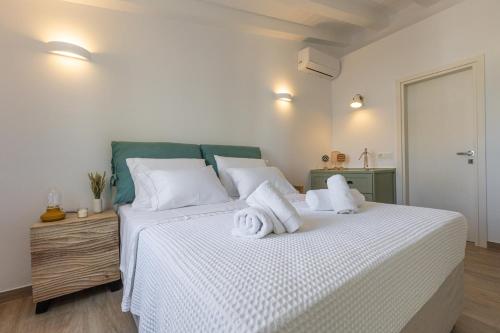 Ένα ή περισσότερα κρεβάτια σε δωμάτιο στο Cristina's Casa