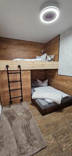 a bedroom with two bunk beds and a rug at Home sweet Home in Havelberg