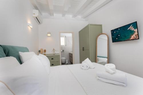 Ένα ή περισσότερα κρεβάτια σε δωμάτιο στο Cristina's Casa