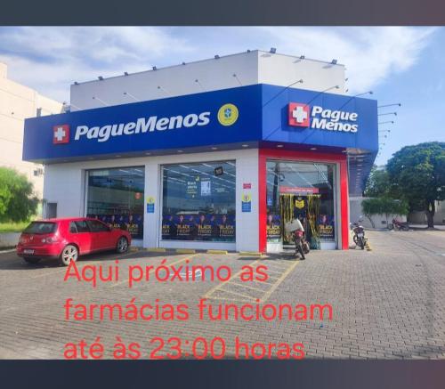 a car parked in front of a car dealership at Hospedagem Sousa Santos in Montes Claros