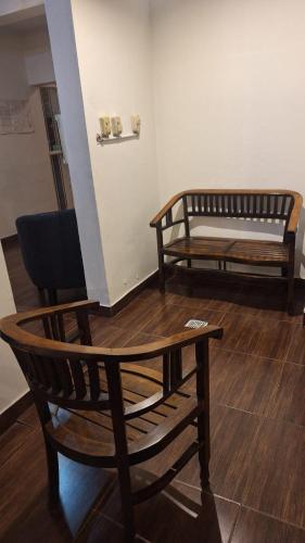 two chairs and a table in a room at Duquesa Valentina Hotel in Salta