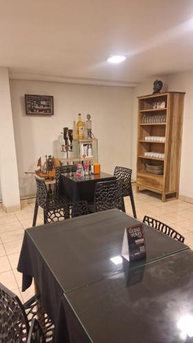 a dining room with a table and some chairs at Duquesa Valentina Hotel in Salta