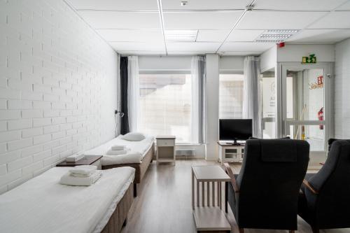 Katil atau katil-katil dalam bilik di Hiisi Hostel Vihti Selli