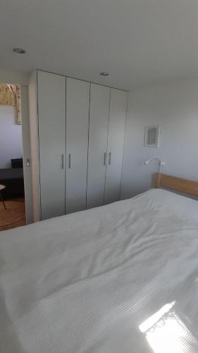Postel nebo postele na pokoji v ubytování Tiny Haus C235 Wacholderdrossel