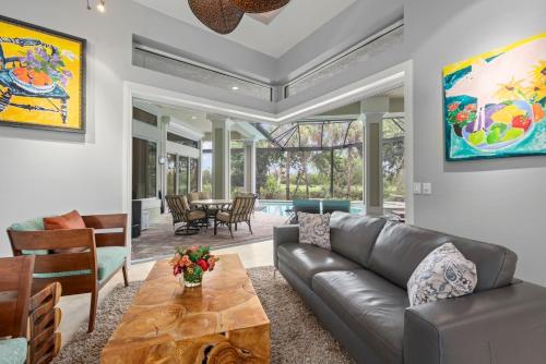 a living room with a couch and a table at Sanctuary Chateau in Sanibel