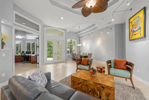 a living room with a couch and a table at Sanctuary Chateau in Sanibel