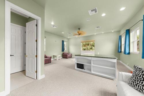 a living room with a couch and a fireplace at Sanctuary Chateau in Sanibel
