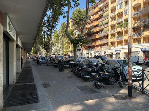 a row of motorcycles parked on a city street at Masonber trastevere centro Wi-Fi free balcone metro in Rome