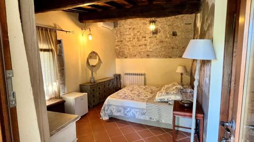 Una cama o camas en una habitación de L'Ape