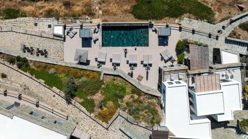 an aerial view of a building with a swimming pool at Sigma Residences Boutique Hotel in Exámbela