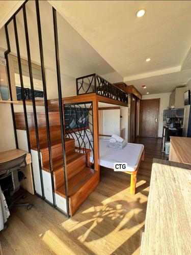 a room with a bunk bed and a staircase at the 5th floor in Baguio