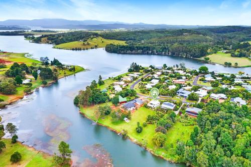 an aerial view of a town next to a river at Oleander Escape Lake Front Retreat in Yungaburra