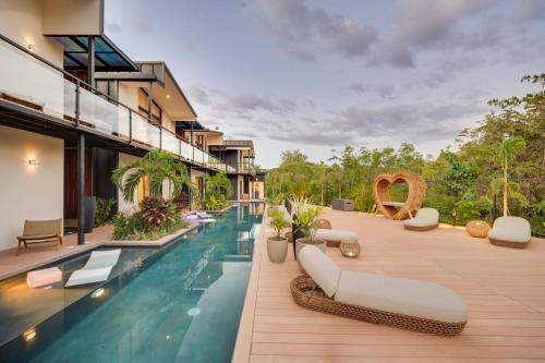 an image of a swimming pool at a villa at The Bungalows Flamingo - 10 Unit Boutique Hotel in Playa Flamingo