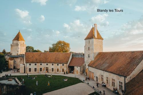 an aerial view of a castle with two towers at LE CERISIER in Sivry-Courtry