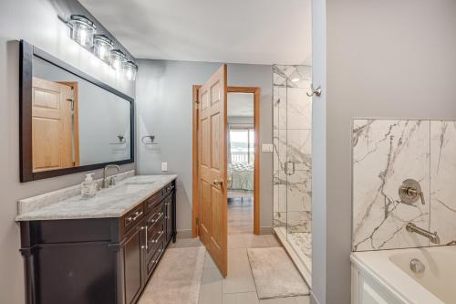 a bathroom with a sink and a shower at Lake Mary View Pickleball Paradise Penthouse Unit in Twin Lakes