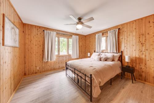 a bedroom with a bed and a ceiling fan at Lake Mary View Pickleball Paradise Penthouse Unit in Twin Lakes
