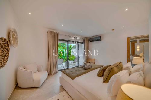 Ένα ή περισσότερα κρεβάτια σε δωμάτιο στο Prestigious villa on Golf - Facing Ile aux Cerfs
