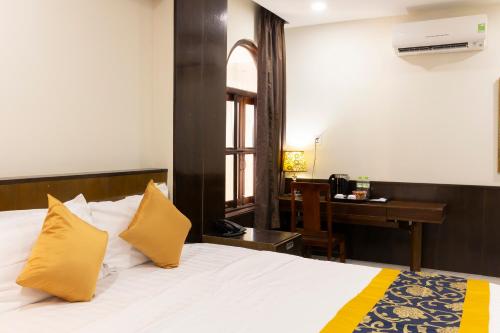 Ένα ή περισσότερα κρεβάτια σε δωμάτιο στο Atana Saigon Boutique Hotel II