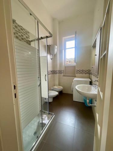 a bathroom with a shower and a toilet and a sink at Sarno La Vecchia Cascina in Sarno