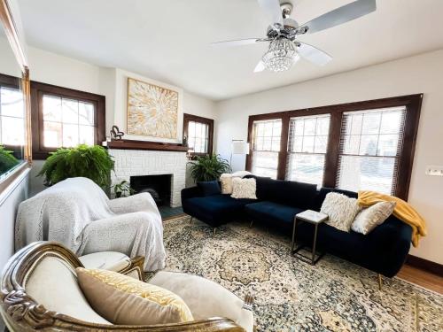 a living room with a couch and a fireplace at Downtown Boho Home wOffice Yoga StudioKing Bed in La Crosse