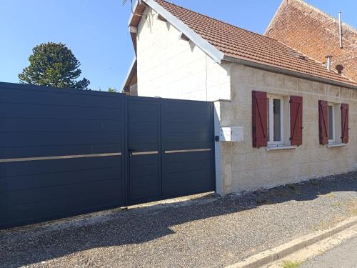 a black gate in front of a house at La Maison du Sapin 