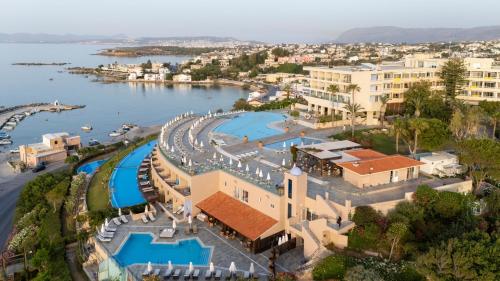 an aerial view of a resort with a pool at Leptos Panorama Hotel in Kalamaki Chanion