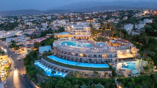 an aerial view of a large building with a pool at Leptos Panorama Hotel in Kalamaki Chanion