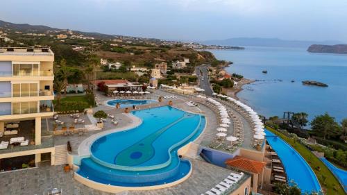 an aerial view of a resort with a swimming pool at Leptos Panorama Hotel in Kalamaki Chanion