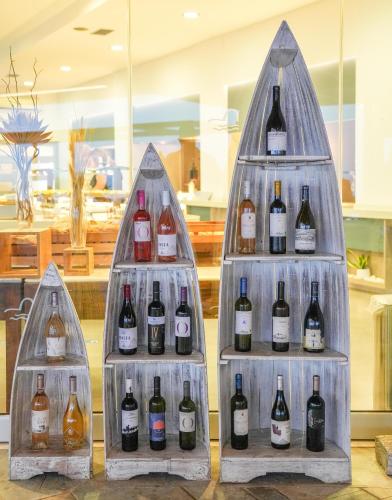 a display of three bottles of wine in a store at Leptos Panorama Hotel in Kalamaki Chanion