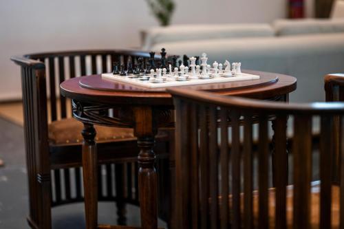 a chess board on top of a wooden table at Leptos Panorama Hotel in Kalamaki Chanion