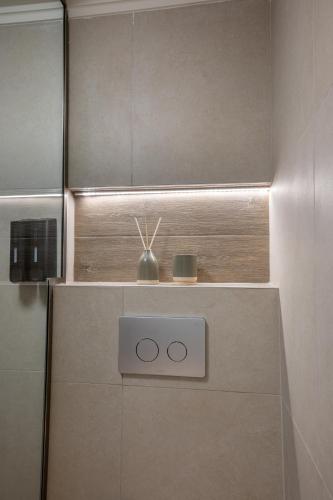 a bathroom with a cabinet with aperature at Filoxenia Apartments in Mytilini