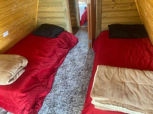 Ein Bett oder Betten in einem Zimmer der Unterkunft Chalé Bela Vista