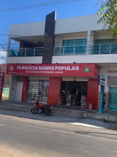 a motorcycle parked in front of a building at Apartamento panorâmico com 2 suítes 1 quarto in Petrolina