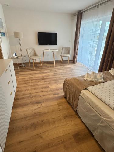 Ένα ή περισσότερα κρεβάτια σε δωμάτιο στο AZUR Apartments Alsóörs