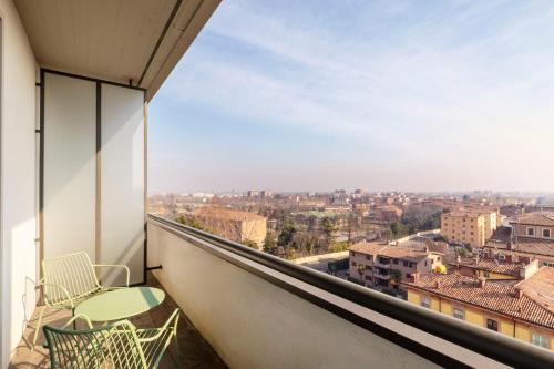 a balcony with a view of a city at B&B Hotel Modena in Modena