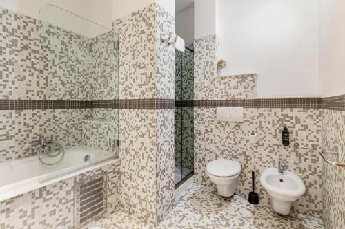 a bathroom with a toilet and a sink at B&B Hotel Modena in Modena