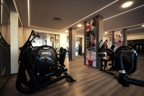 a gym with two elliptical machines in a room at Sunny Days El Palacio Resort & Spa in Hurghada