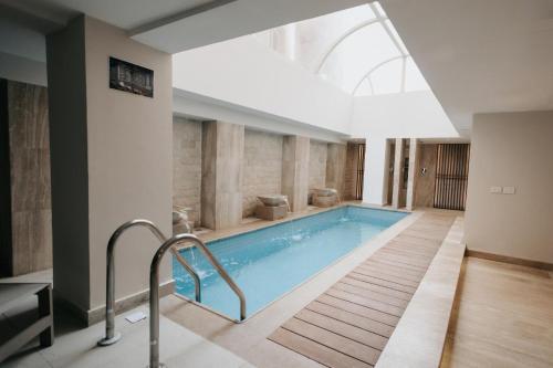 a swimming pool with a skylight in a building at Baron Hotel Cairo in Cairo