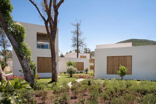 a rendering of a house with trees in the yard at Voyage Torba Hotel in Torba