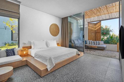 a bedroom with a bed and a living room at Voyage Torba Hotel in Torba