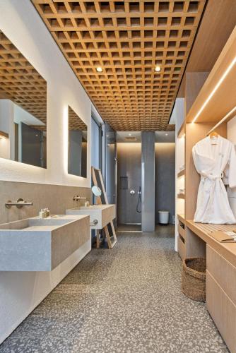 a large bathroom with a sink and a mirror at Voyage Torba Hotel in Torba