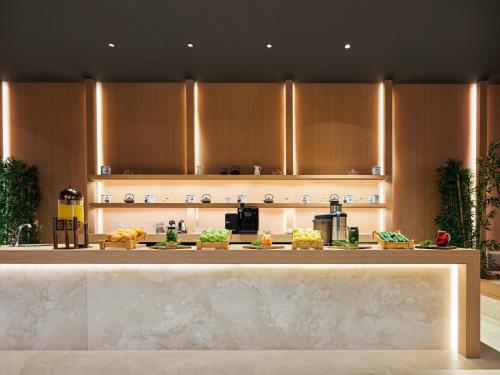 a kitchen with a counter with food on it at Voyage Torba Hotel in Torba
