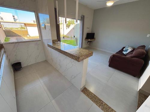 Khu vực ghế ngồi tại Casa Tartaruga 4 - Sofisticação a 50m da Praia de Guriri