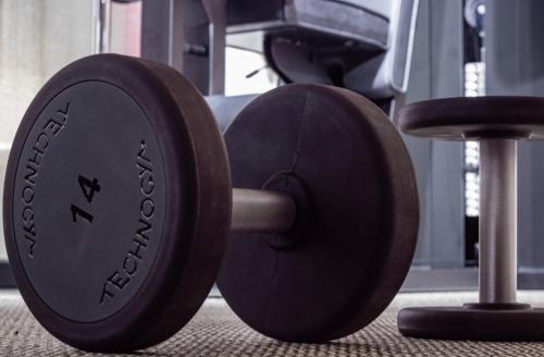 a barbell sitting on the floor in a gym at Nomad Hotel & Spa Altea in Altea