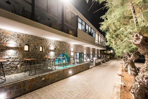 a brick building with a bar on the side at Nana Golden Beach All Inclusive Resort & Spa in Hersonissos