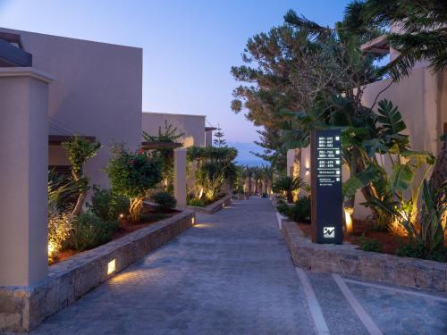 a street with a sign in the middle of a building at Nana Golden Beach All Inclusive Resort & Spa in Hersonissos